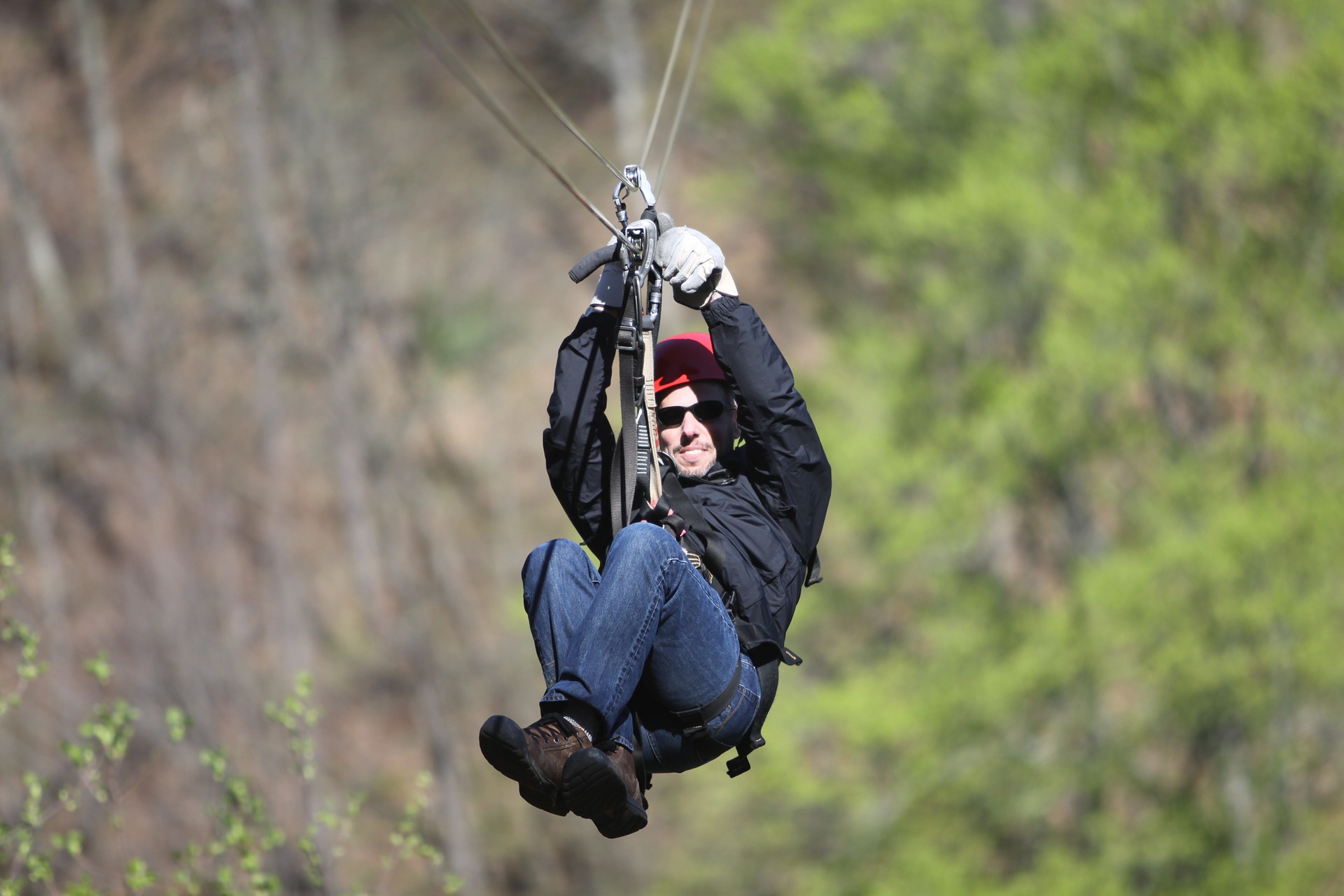 A man having fun on one of the zip line tours near Denver