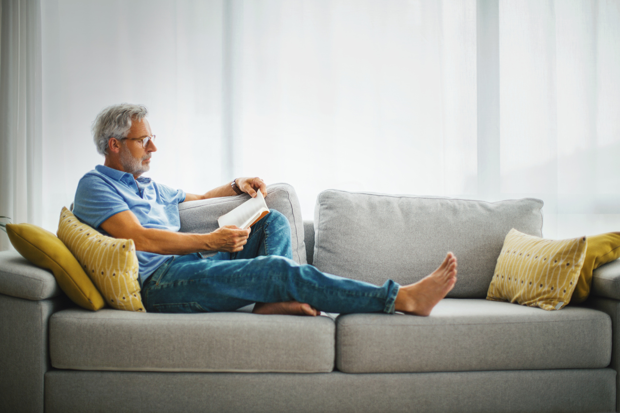 man reading on the couch | Douglas County Library