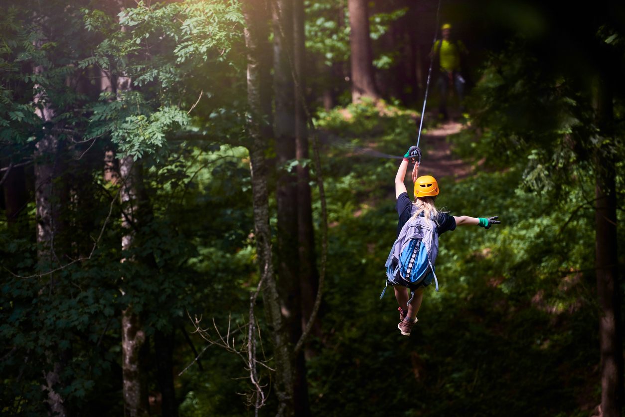 ziplining through trees | adventures parks around Highlands Ranch