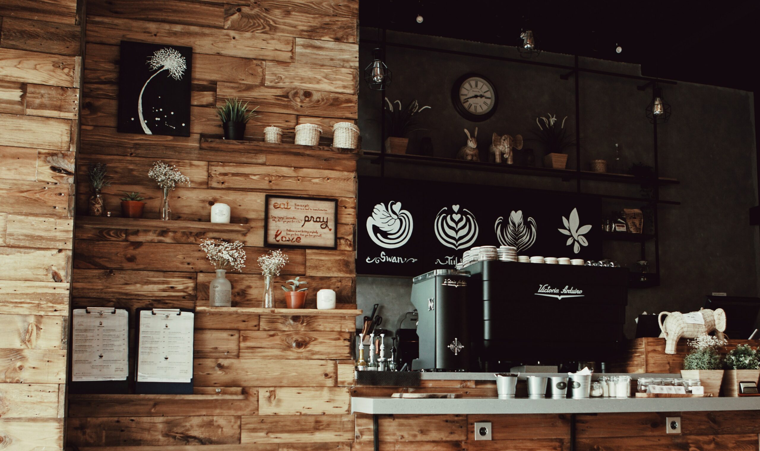 interior of a cafe with a coffee machine on the counter and decor on the wooden walls | hot chocolate highlands ranch