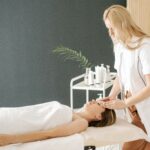 woman being massages on her head at a salon | massage Highlands Ranch