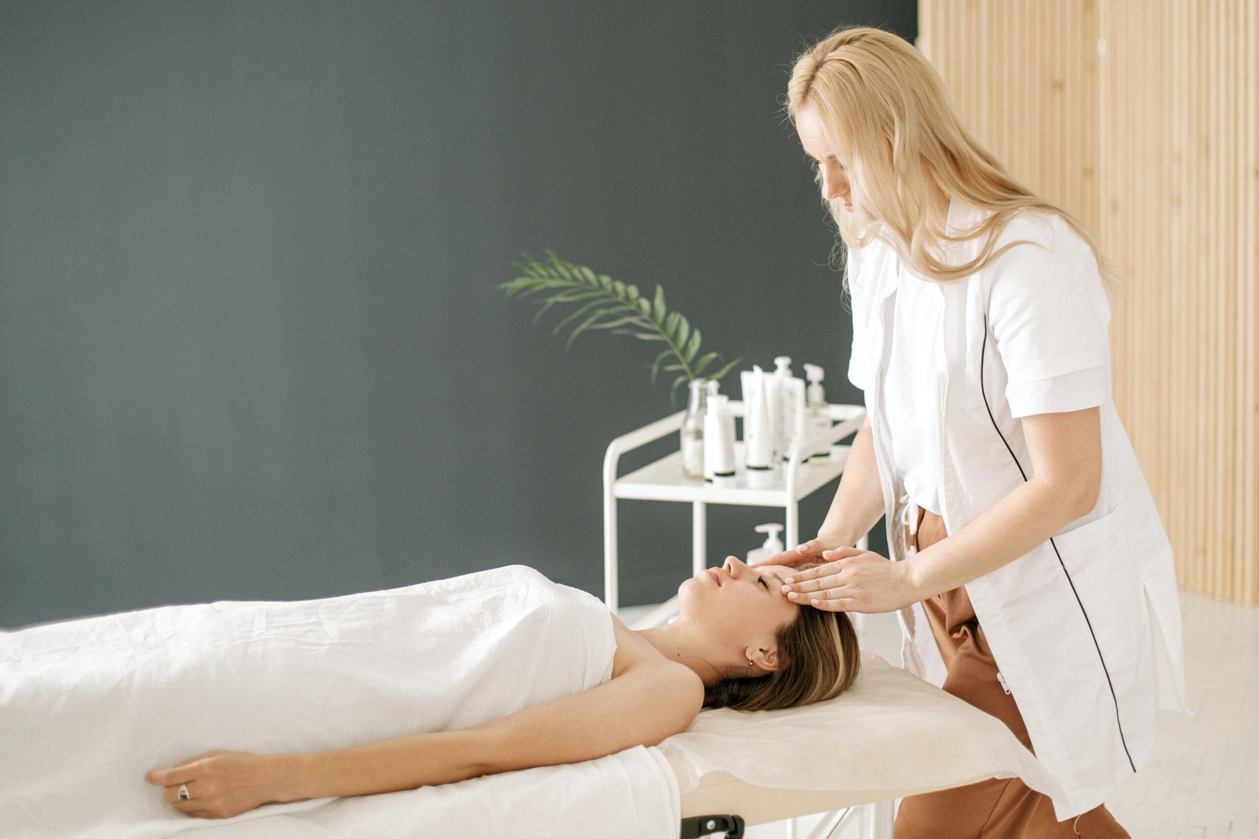 woman being massages on her head at a salon | massage Highlands Ranch
